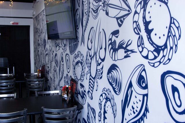 Wallcovering graphics installed on a commercial interior surface